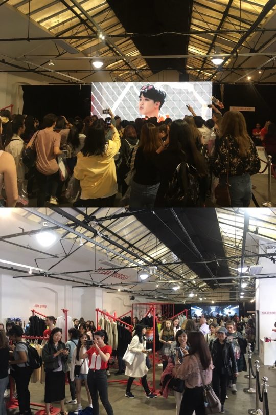 그룹 방탄소년단(BTS)의 팝업 스토어를 방문한 아미(ARMY)들이 영상에 맞춰 노래를 따라 부르고 사진을 찍고 있다. /런던=김하진 기자