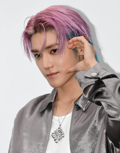 NCT Taeyong, the visual of a man tearing out of a cartoon...cool