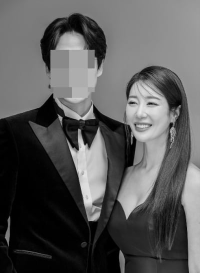 Butterfly, bright smile next to her handsome husband