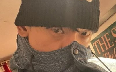 Rain wears a luxury beanie and just takes his eyes out