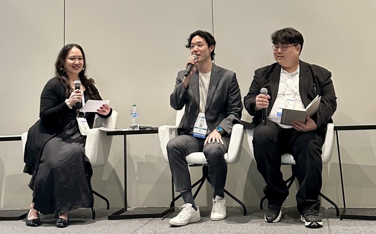 Cosmax's Roh Jung-kyun (center) and Park Se-ho (right) discuss the future of K-beauty ingredients with Dr. Jane Yoo at the 2026 NYSCC Suppliers' Day in New York. / Cosmax
